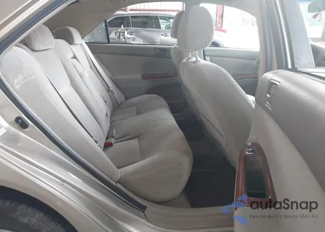 2003 Toyota Camry Le z USA, uszkodzony, nr VIN 4T1BE32KX3U143055